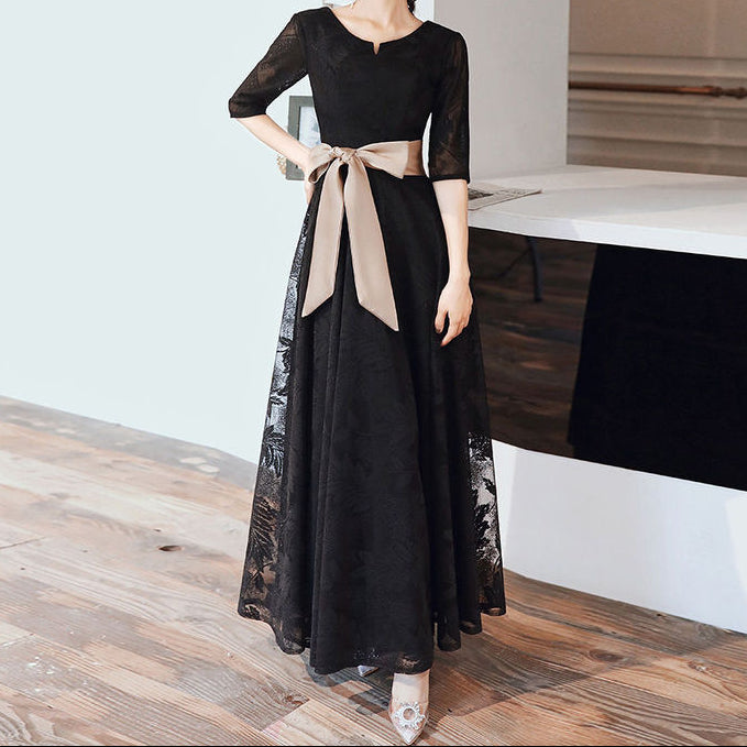 Back view showing elegant draping and lace pattern throughout