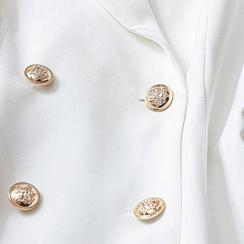 Side profile of blazer highlighting sleeve length and shoulder seaming