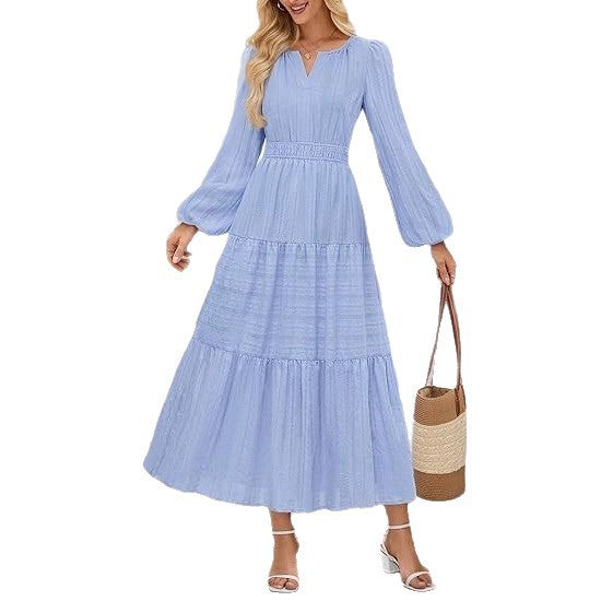 Back view of v-neck maxi dress showing waist cinching and ruffled skirt