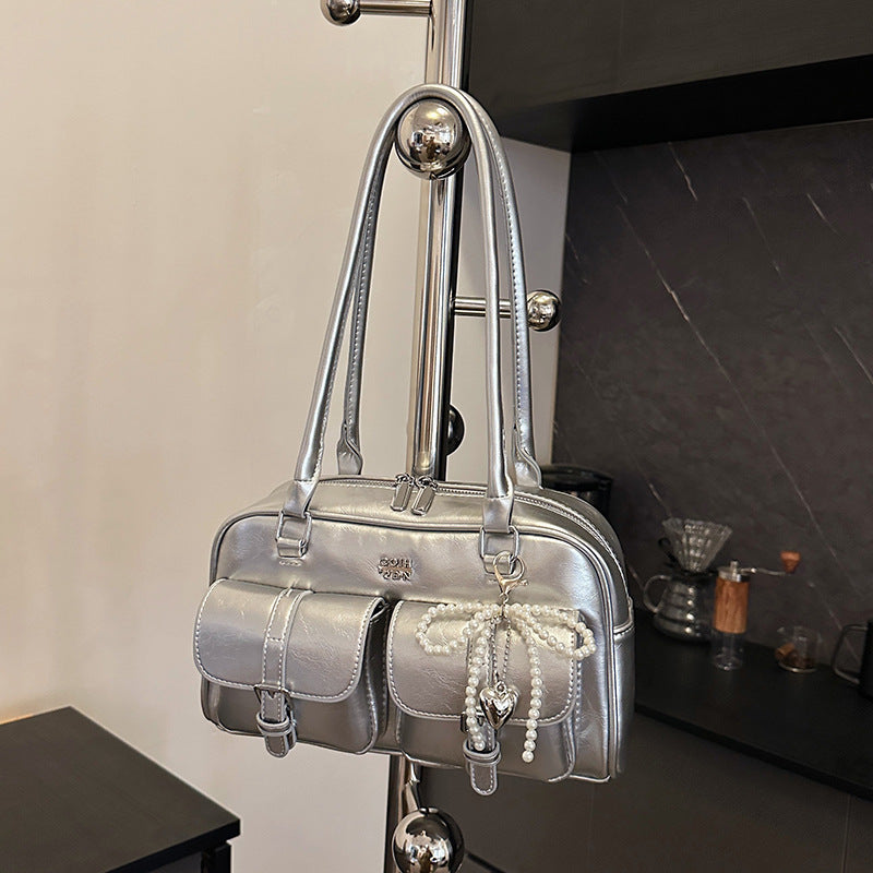 Three-quarter view of underarm bag in natural lighting