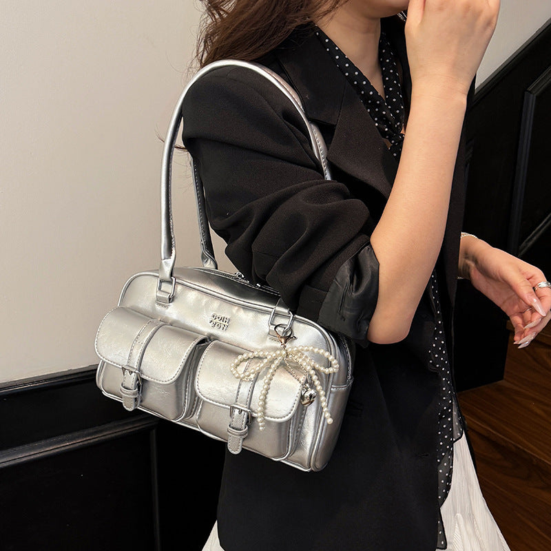 Close-up of bag strap showing stitching and attachment point detail