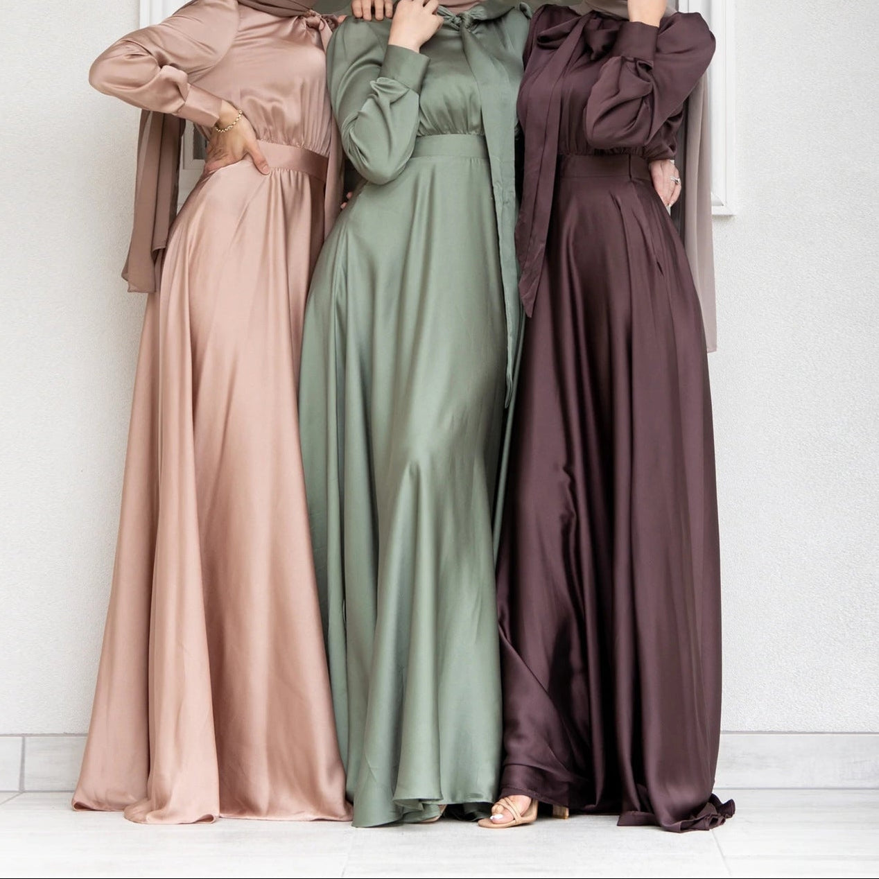 Close-up of luxurious satin fabric texture and draping detail on dress bodice