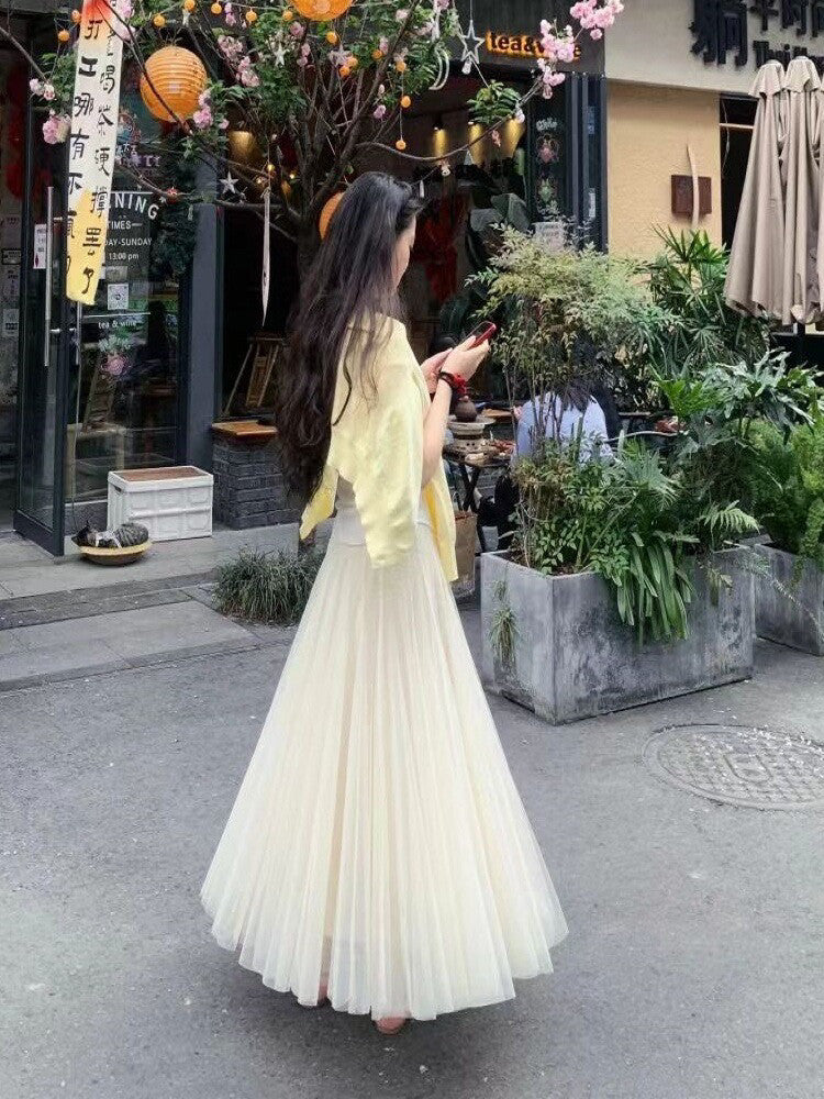 Side profile of high-waist midi skirt displaying flattering silhouette and fit
