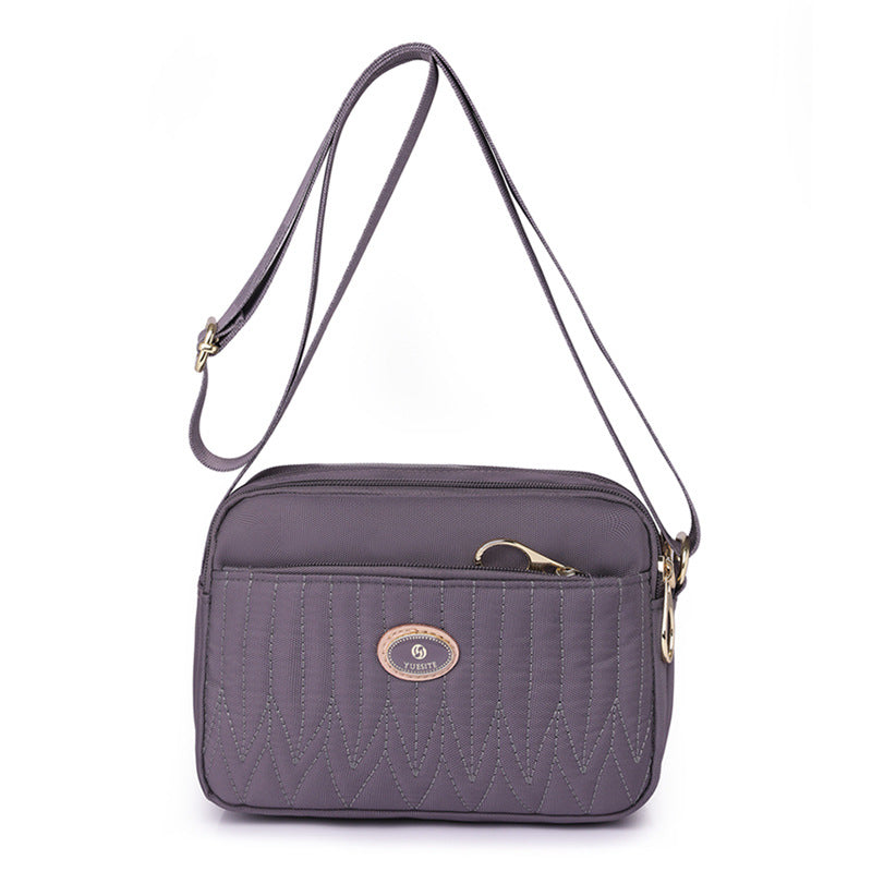 Top-down flat lay of crossbody bag showing dimensions and opening