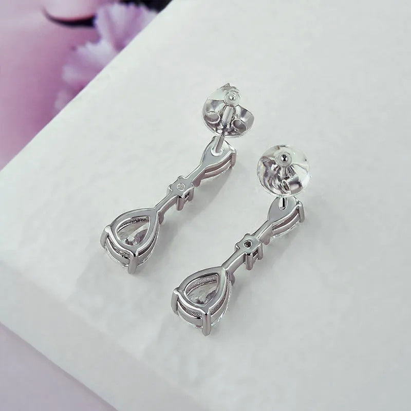 Close-up of teardrop earring design showing intricate beadwork and craftsmanship
