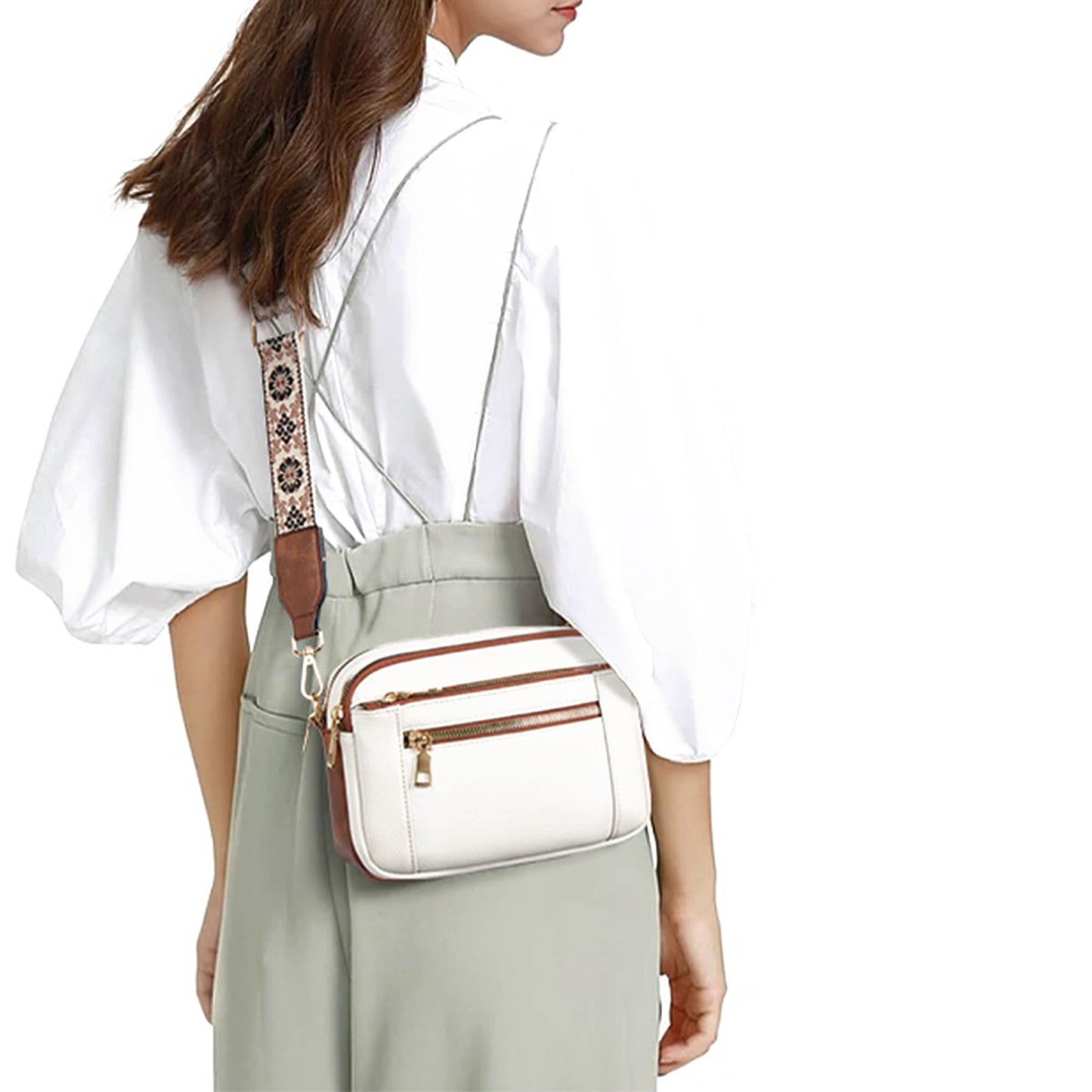 Back view of cream floral bag displaying plain exterior and strap attachment