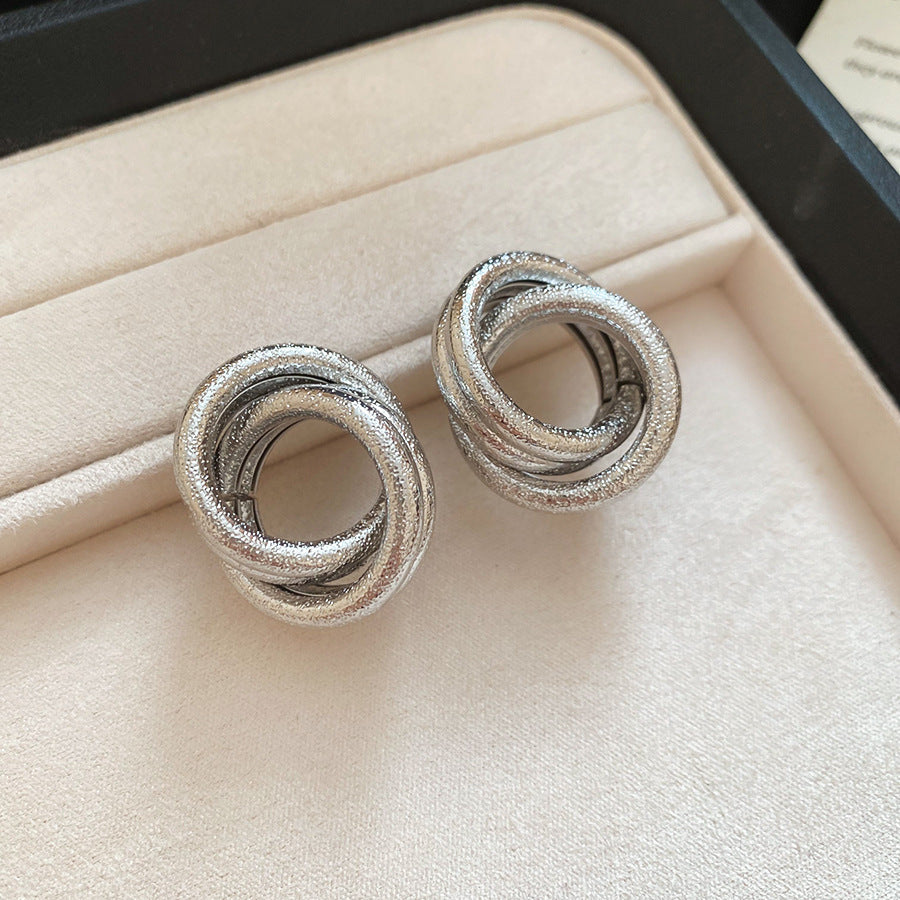 Silver hoop earrings with polished finish, elegant luxury style for formal occasions
