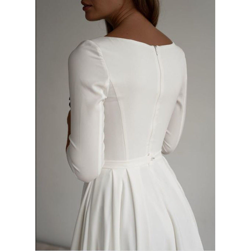 Front neckline detail of white evening dress with modest high collar