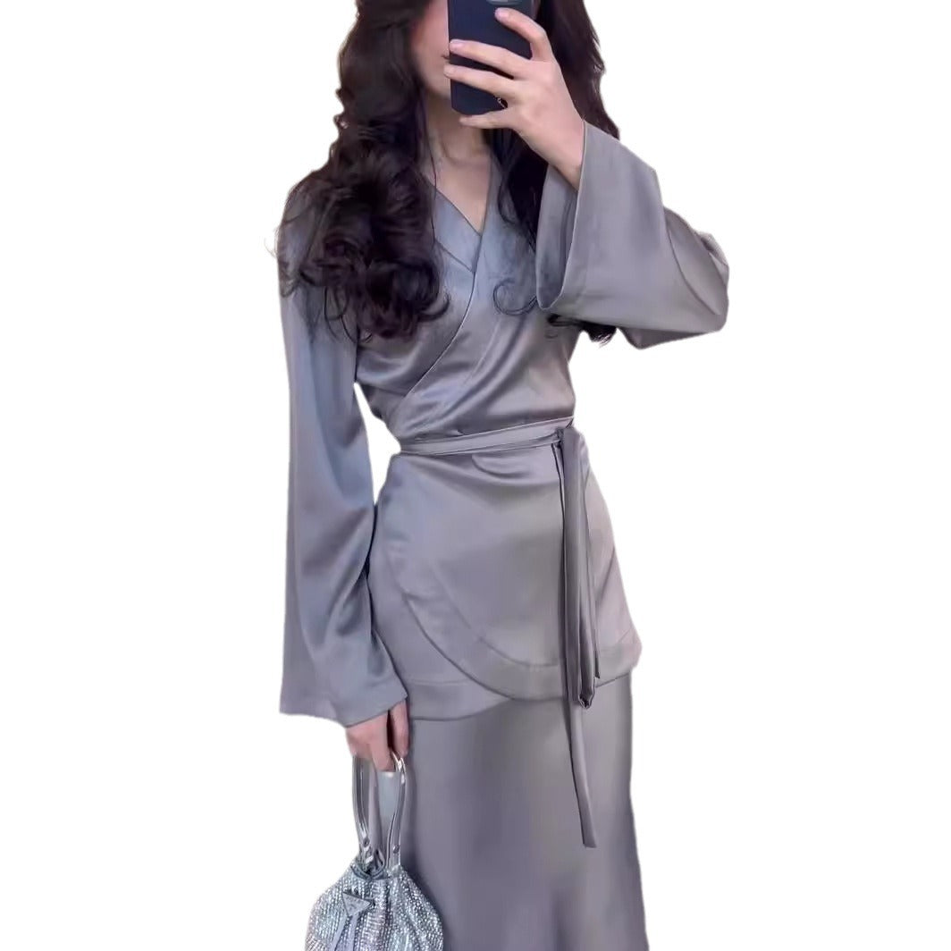Front view of burgundy satin dress suit showing structured bodice