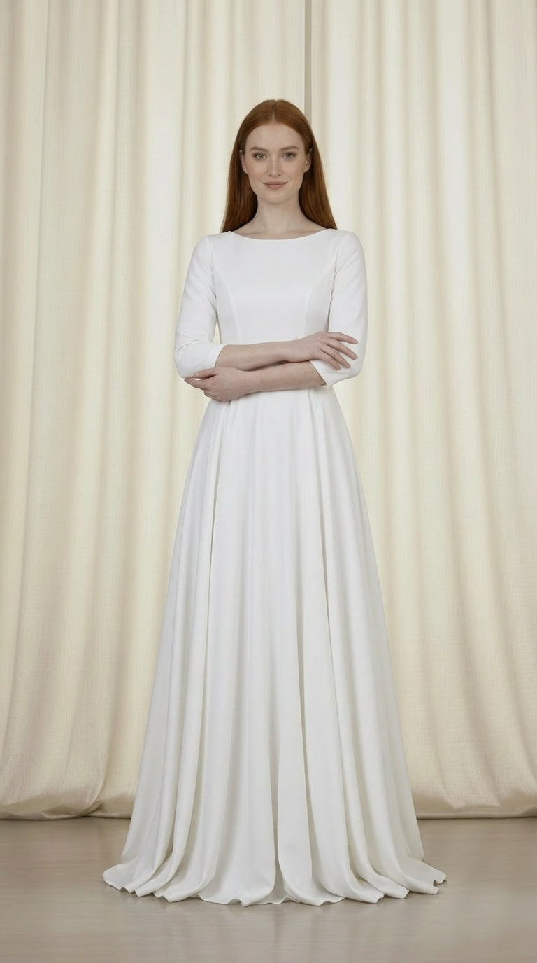 Long white modest evening dress with long sleeves and flowing silhouette