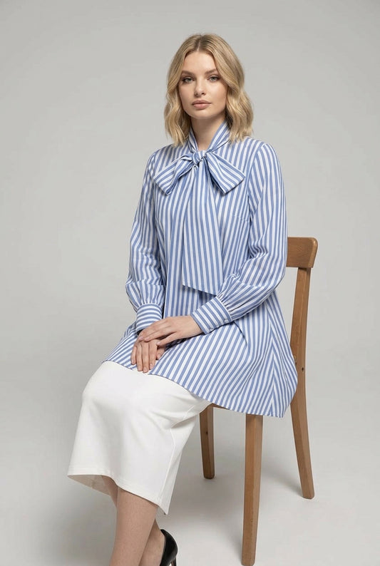 Back view of navy dress showing relaxed silhouette and bow tie detail